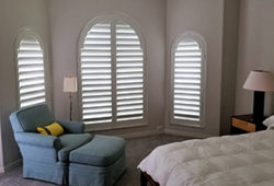 Plantation shutters in a bedroom